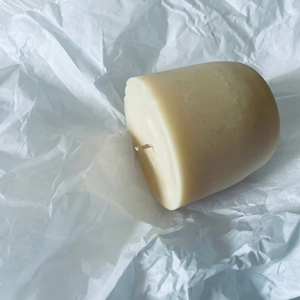 Unlit off-white irregular oval Eco Refill Candle Pod with short wick, perfect for diffuser use