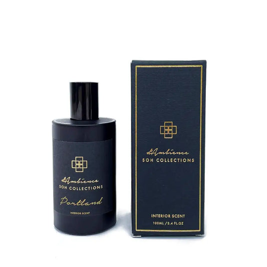 Dark blue Portland Interior Scent bottle and box with gold accents, perfect for home diffuser scents