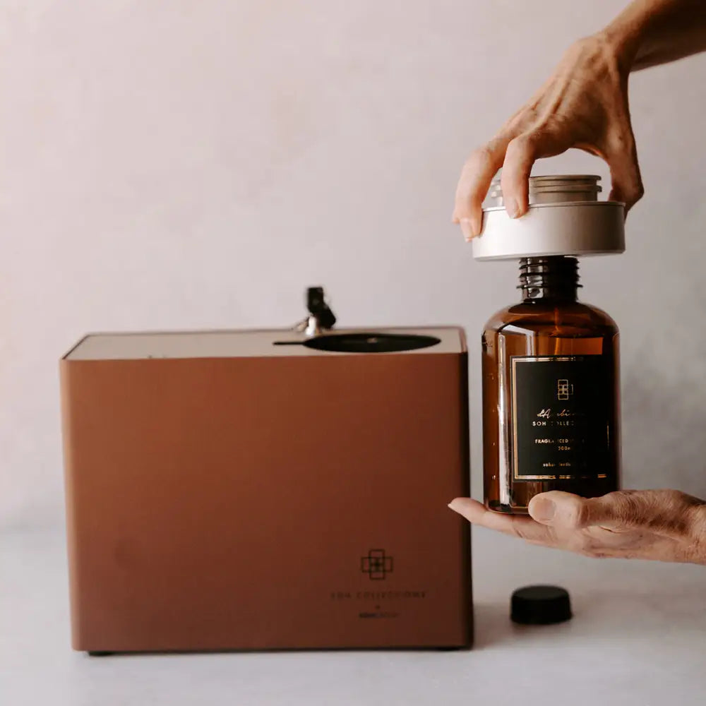 Roma Luxe electric diffuser scenting unit with brown diffuser and amber bottle for home fragrance